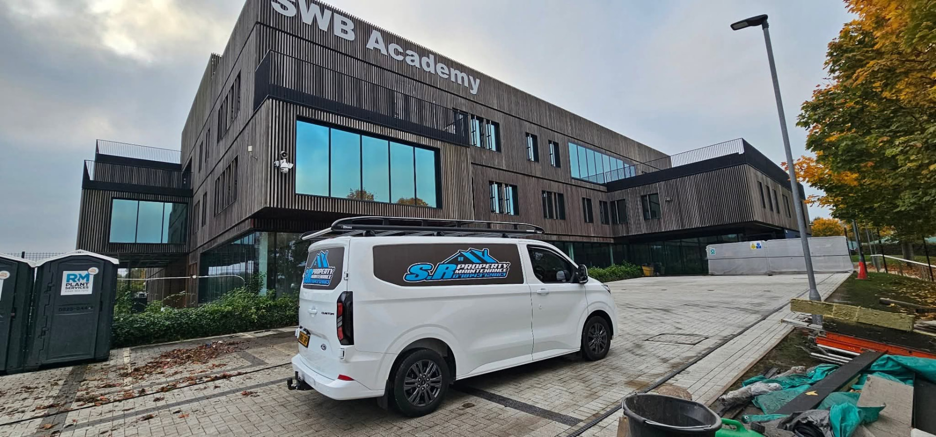 Block paved forecourt with the S R Property Maintenance van parked on it