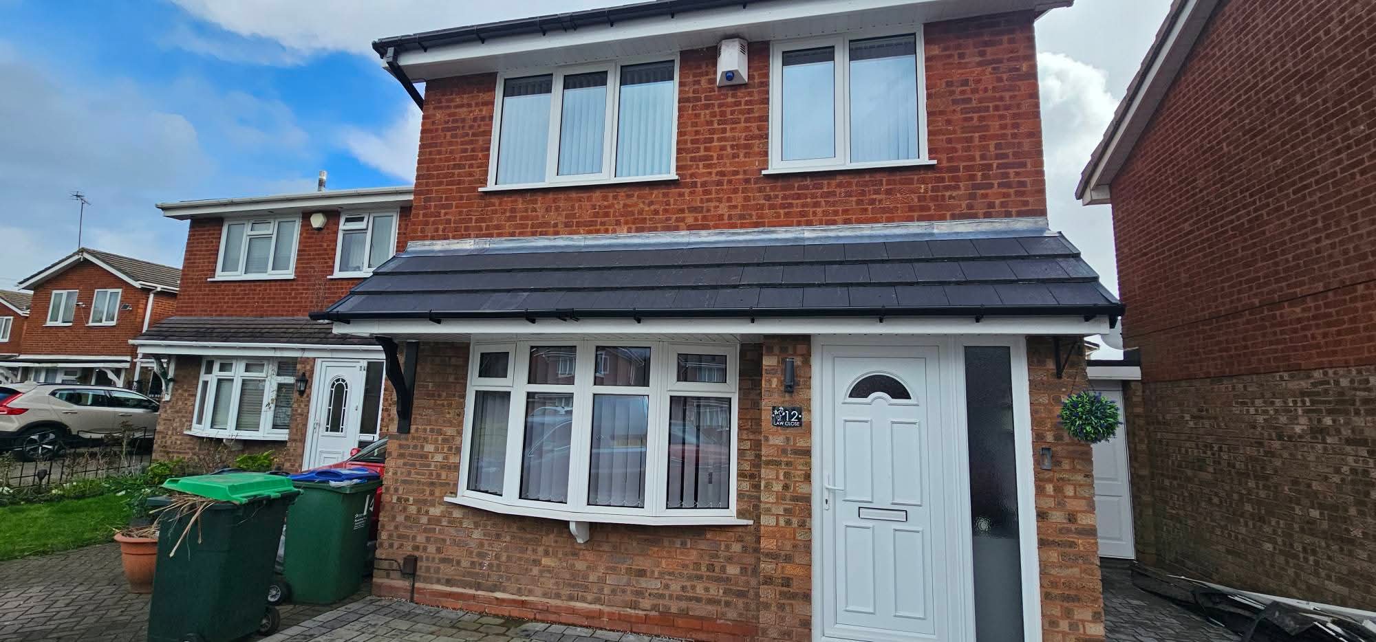 New white fascias, soffits and guttering across a house front