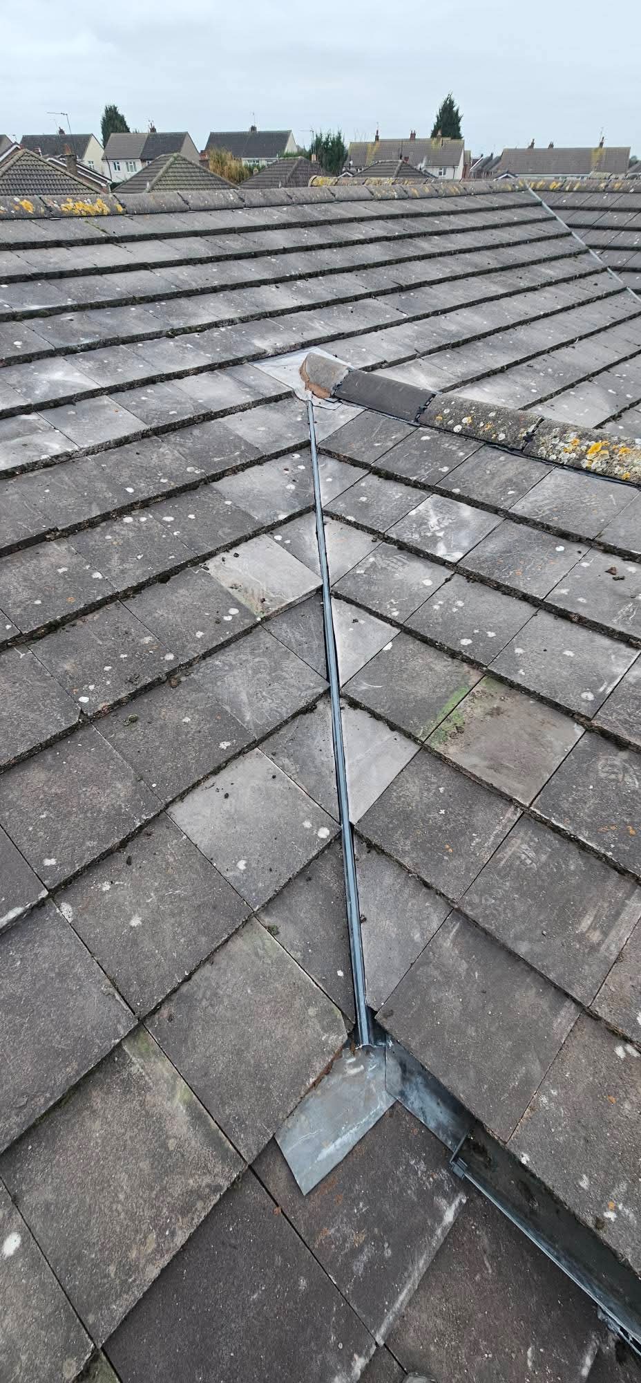 The finished valley and flashing detail running down between the roof slopes