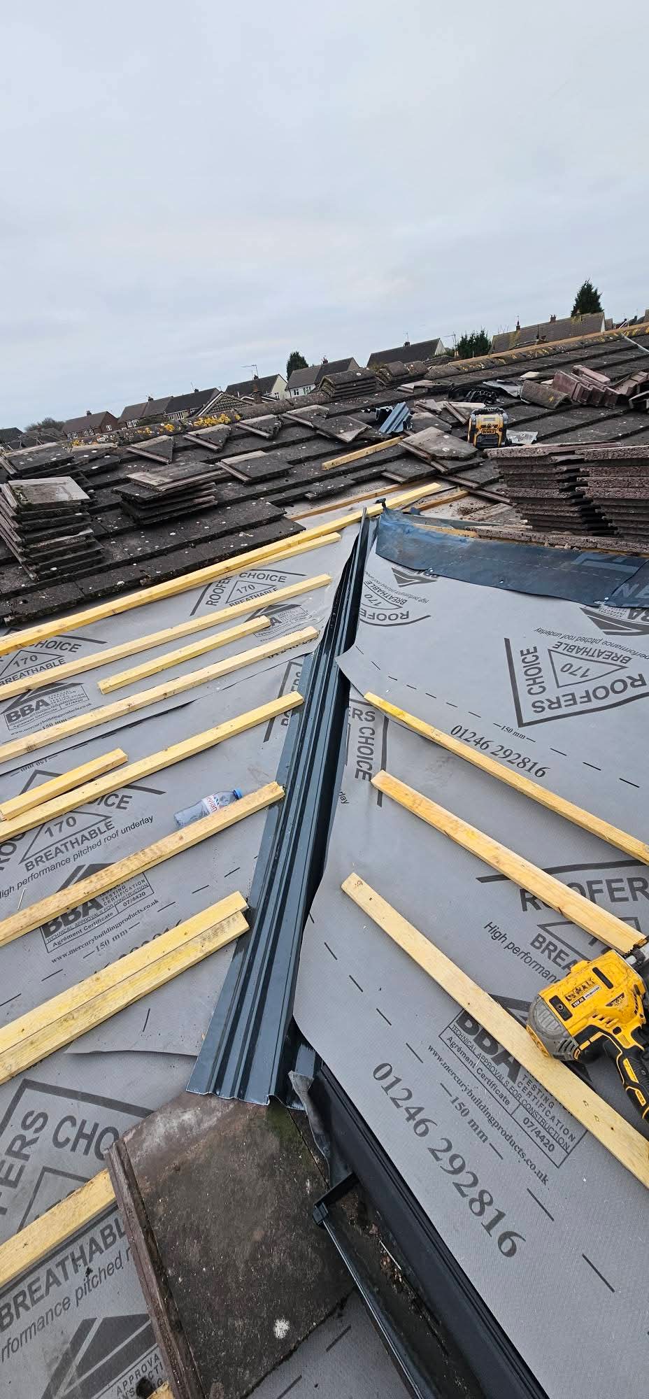 Roof strip and re-roof in progress with new underlay and battens