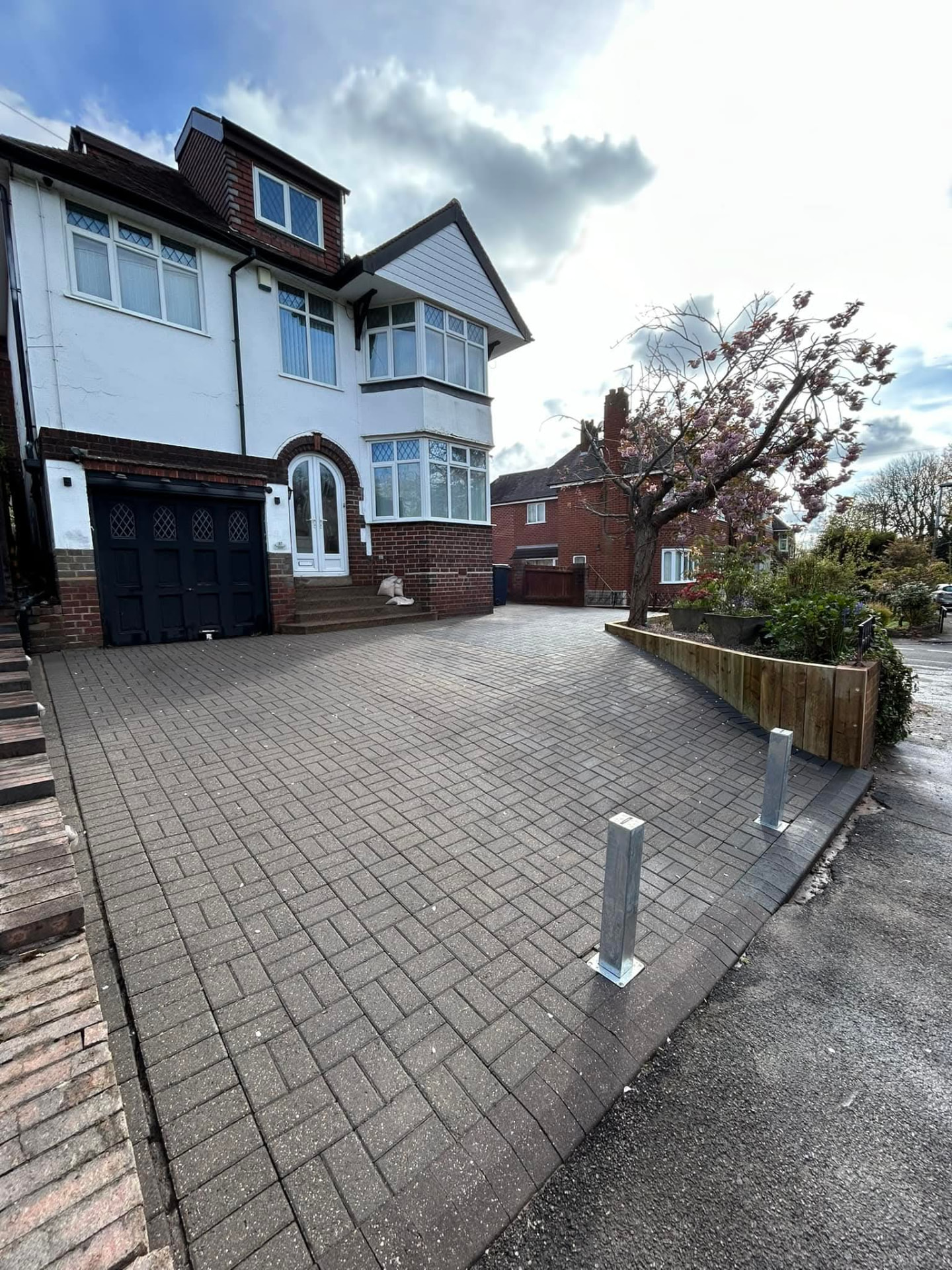 Large block paved driveway laid to the front of a house