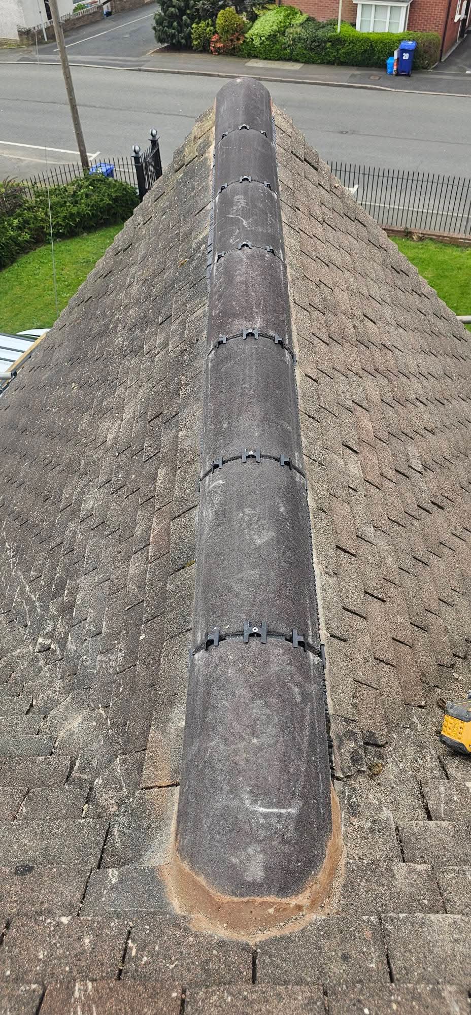 New dry ridge system fitted along a tiled roof